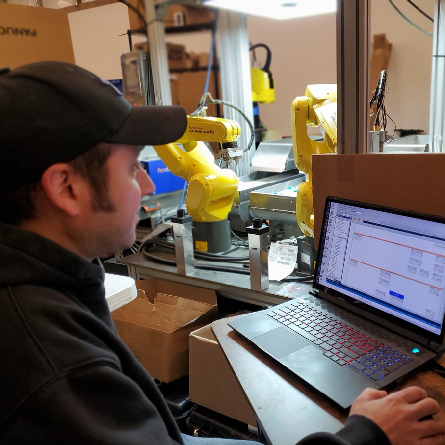 Material Handling with Conveyor, Collaborative Robots, and Custom Tooling